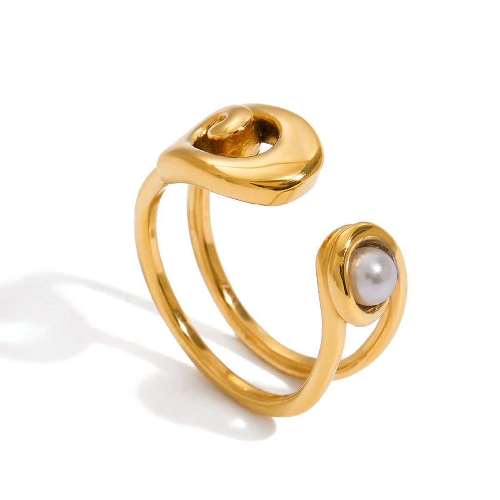 Gold ring with a pearl on a white background