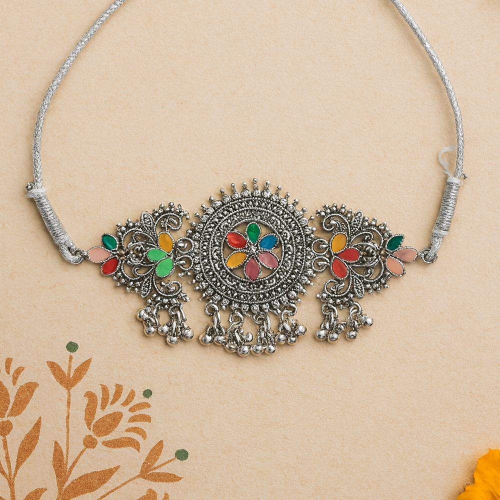 Decorative silver necklace for women with colorful stones on a beige background
