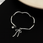 Nysa Silver Bow Cuff Bracelet