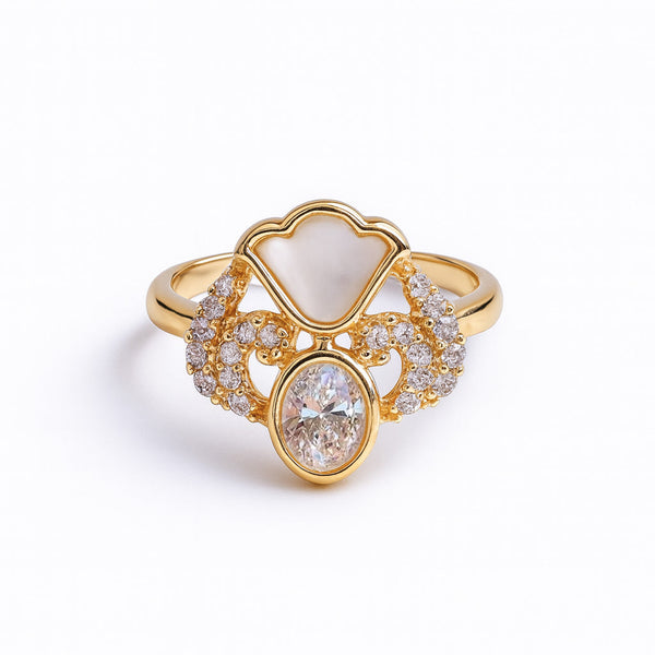 Gold ring with diamond accents on a white background