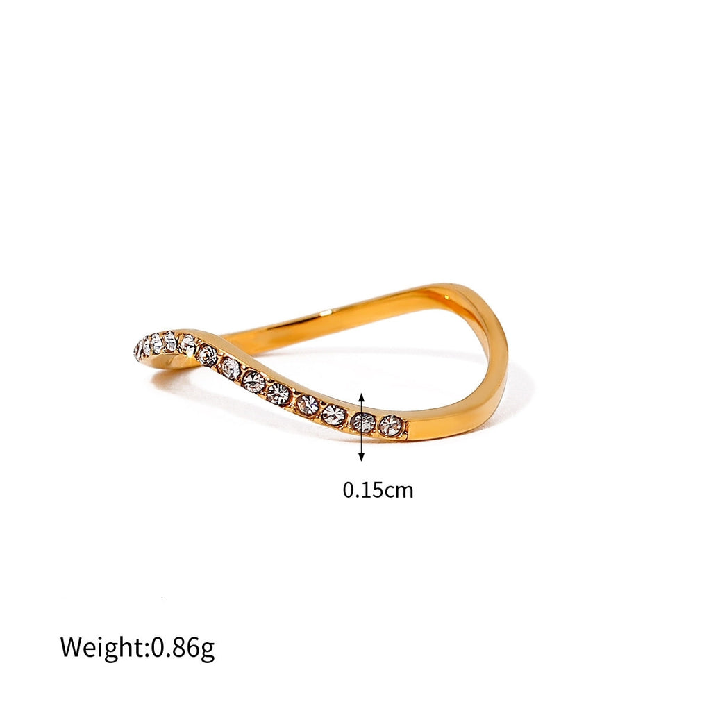 Gold ring with small diamonds on a white background